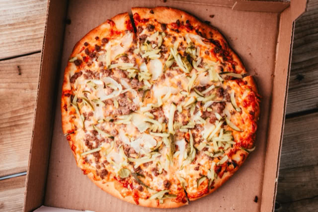 Pizza loaded with various toppings.